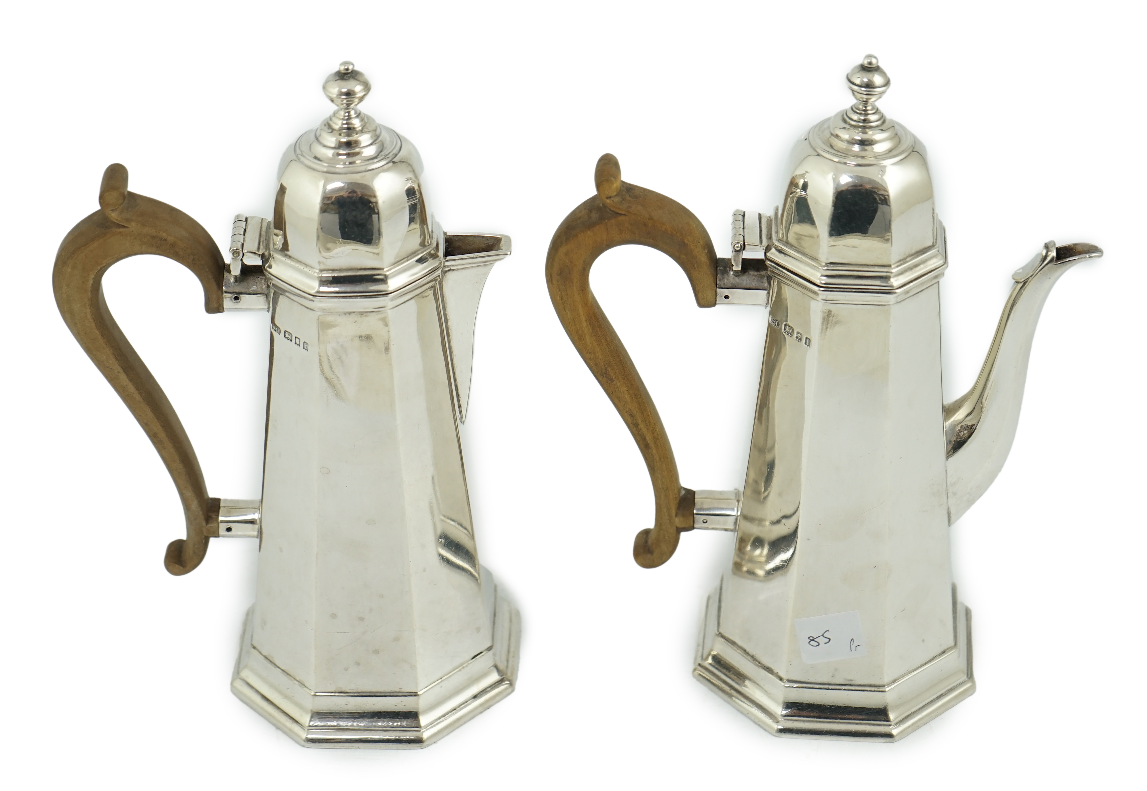 A George V 18th century style silver cafe au lait pair by Garrard & Co